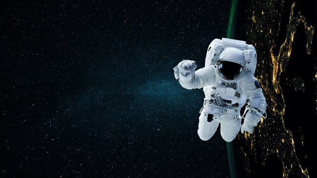 Space man astronaut flying in space with stars and night planet earth. - Powered by Adobe