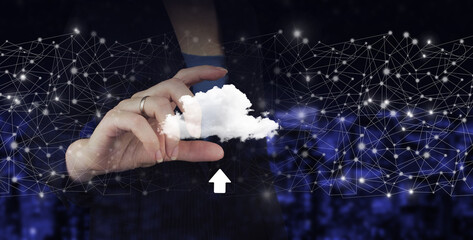 Obraz na płótnie Canvas Cloud computing technology internet concept background. Hand hold digital hologram cloud, download, data sign on city dark blurred background.