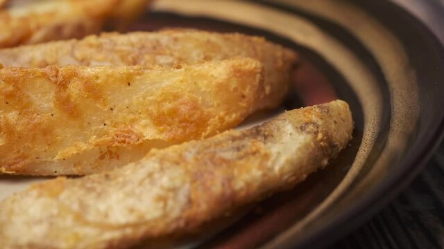 Tasty freshly made wage potato chips in a plate 