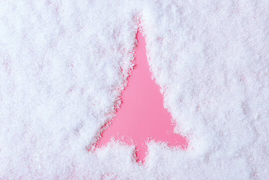 Christmas tree shape drawn in the snow. Christmas and New Year background