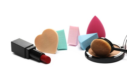 Cosmetic eye shadow makeup palette with beauty blender sponge in shape heart, lipstick and brush isolated on white  