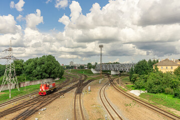 Fototapeta na wymiar A railway interchange in the city limits and a standing train.