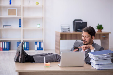 Young male employee working in the office