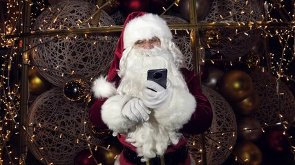 Happy Santa Claus, Saint Nicholas makes a video call to the child or records a virtual greeting on Christmas Eve - Powered by Adobe