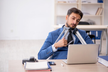 Young male employee after accident at workplace