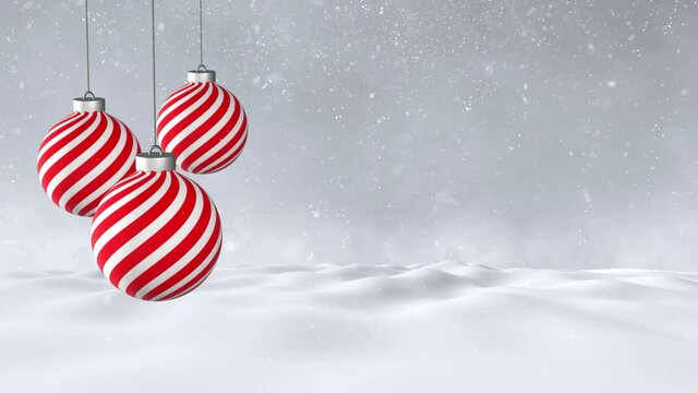 Red striped christmas baubles ornament decoration swinging on the string on a winter landscape with snowfall effect copy space animation background.