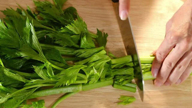Top view of parsley chopped in a wooden chopping board , for plants and vegetables advertising