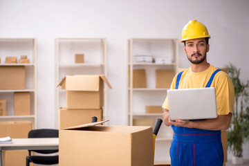 Young male contractor doing home relocation