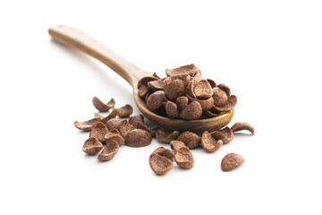 Sweet chocolate breakfast cereal flakes in wooden spoon.