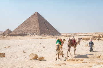 landscape of giza plateau with pyramids at background - obrazy, fototapety, plakaty