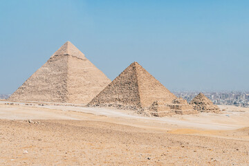 landscape of giza plateau with pyramids at background