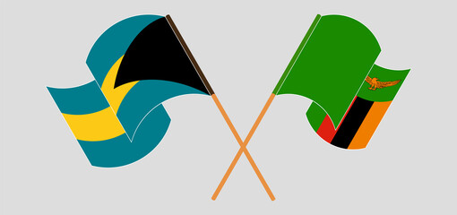 Crossed and waving flags of the Bahamas and Zambia