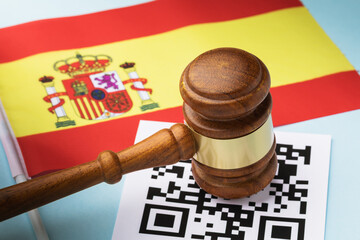 Judge gavel, barcode sheet and Spanish flag, the concept of administrative punishment for violation...
