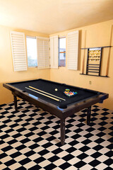New pool table with balls and pool cues