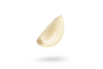 Garlic on a white background. Falling peeled clove of garlic falling on white isolated background...