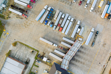 Drone view of the automotive large over road semi-trucks at fueling station