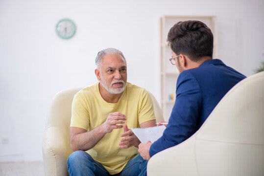 Old Man Visiting Young Male Psychotherapist