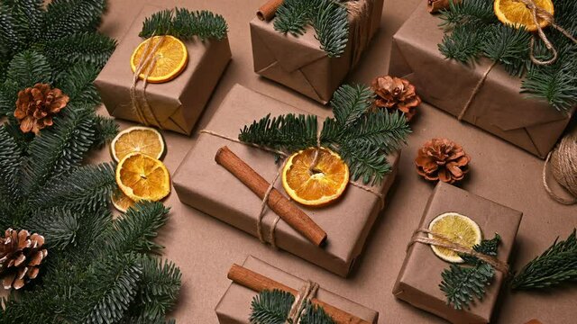 Christmas ecological flatlay.Gift appearing wrapped on eco-friendlycrafy paper