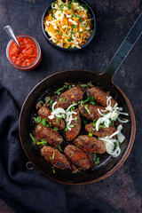 Traditional Croatian cevapcici spicy meat ball rolls with cabbage carrot salad and hot ajvar sauce...