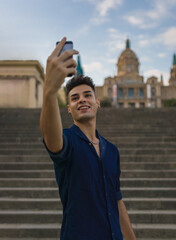 Young man taking a selfie in the street