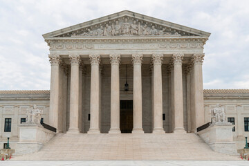 Front view of the iconic building of United States Supreme Court at day time, Washington DC, USA....