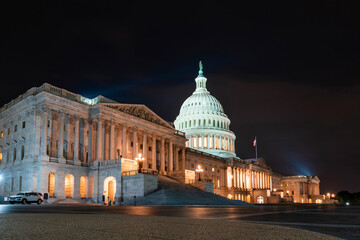 Neoclassical architecture of the Capitol dome building at night, Washington DC, USA. Illuminated...