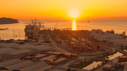 AERIAL: Spectacular drone view of the port of Koper on a beautiful sunny evening - obrazy, fototapety, plakaty