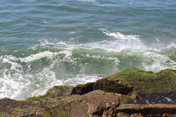 waves crashing on rocks