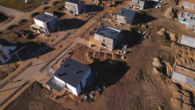 Construction suburb houses. Building a country house of expanded-clay concrete blocks. Home construction from a ceramsite blocks. Construction work and laying bricks and roof in private homes.