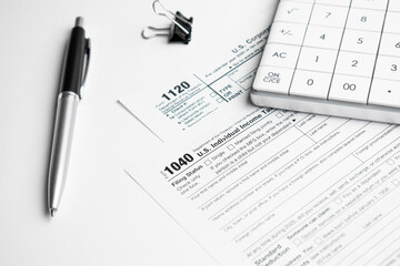 Filling in tax form 1040 for year 2021. Tax concept
