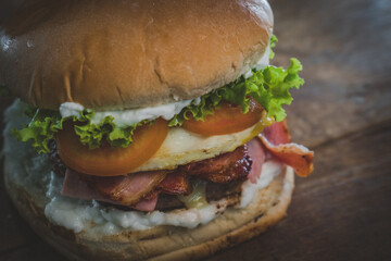hamburger, lettuce, tomato, bacon, egg