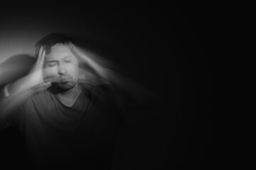 Blurred male portrait in the dark. Male portrait in motion in the dark. 
