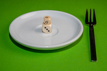 Concept Image for 3G control, white cubes form 3G on a withe plate against a green background
