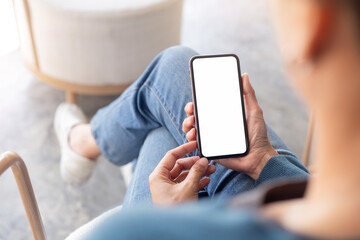 cell phone blank white screen mockup.hand holding texting using mobile on desk at office.background empty space for advertise.work people contact marketing business,technology