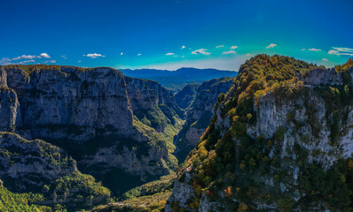 Aerial panoramic view of the impressive Vikos gorge in the Zagoria region at Pindus Mountains of northern Greece. It lies on the southern slopes of Mount Tymfi and it is the the deepest in Europe.