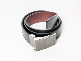 Photo of black leather belt isolated on white background.