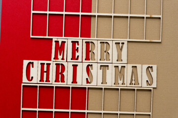 the expression "merry christmas" in wood stencil font