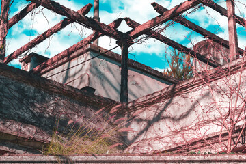 Low angle view of an old gazebo with symmetrical shapes. Abandoned on the outside.
