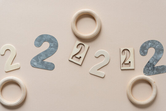 the number two (2) repeated in various fonts on paper