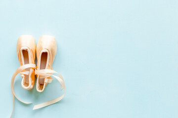 Pastel beige ballet pointe shoes or slippers with ribbon