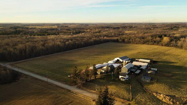 Country winter landscape without snow. Farm, agricultural fields. Aerial overhead view. Midwest USA. Sunset sunlight