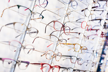 Image of spectacles on shelf in optical store, nobody