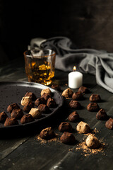 chocolate truffles over rustic wood table