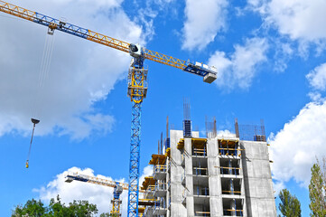 Crane and highrise construction site