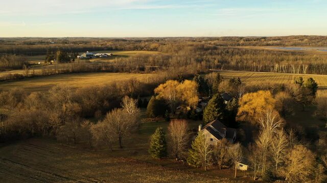 Country winter landscape without snow. Farm, agricultural fields. Aerial overhead view. Midwest USA. Sunset sunlight