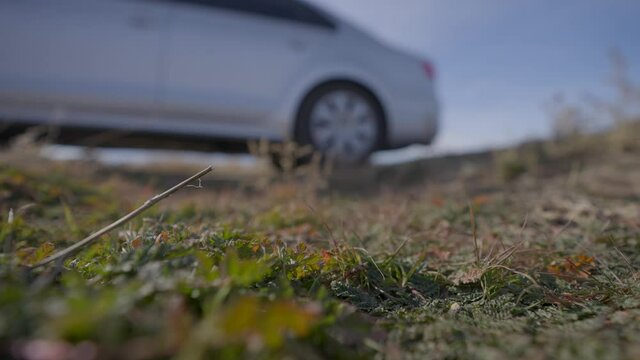 Small Car driving offroad on a gravel path