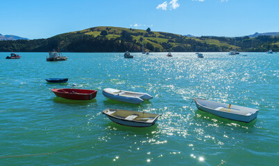 Dinghy and Boats at Akaroa Beach on the Banks Peninsula, southeast of Christchurch, South Island,...