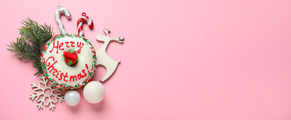 Tasty Christmas donut and decorations on pink background with space for text