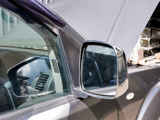 Close up photo of pickup truck car side mirror.