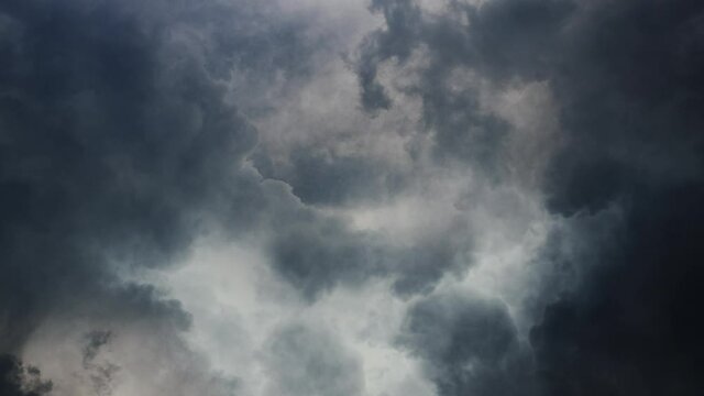 thunderstorms and cumulonimbus clouds with lightning strikes